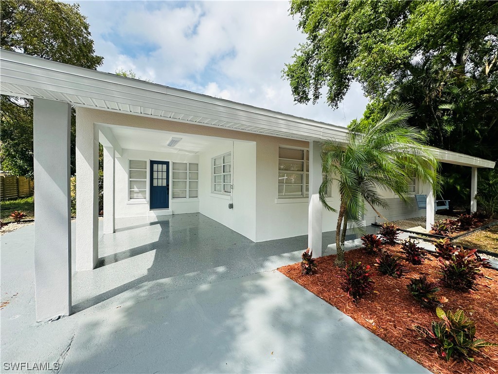 2926 Holly Road Fort Myers, FL 33901 - Photo 6 of 47 a view of a house with backyard and sitting area