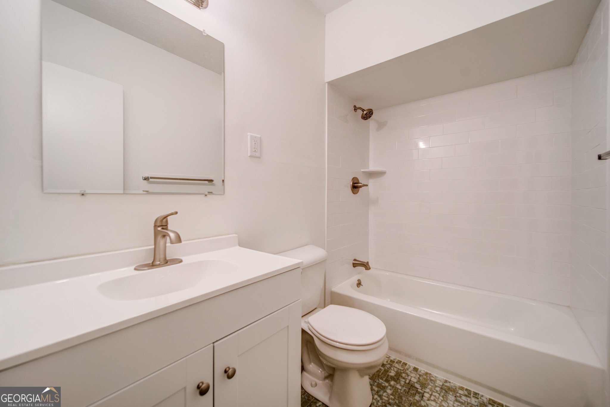 144 Jackson Street Newnan, GA 30263 - Photo 4 of 19 a bathroom with a sink a toilet and shower