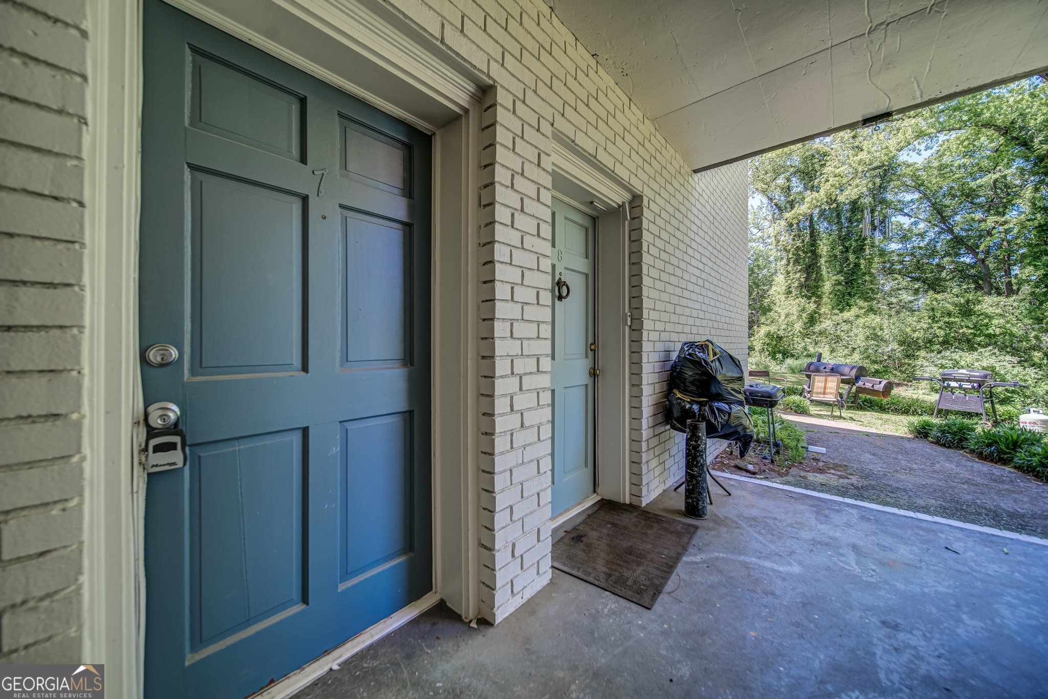 144 Jackson Street Newnan, GA 30263 - Photo 6 of 19 a view of a porch with furniture and a yard