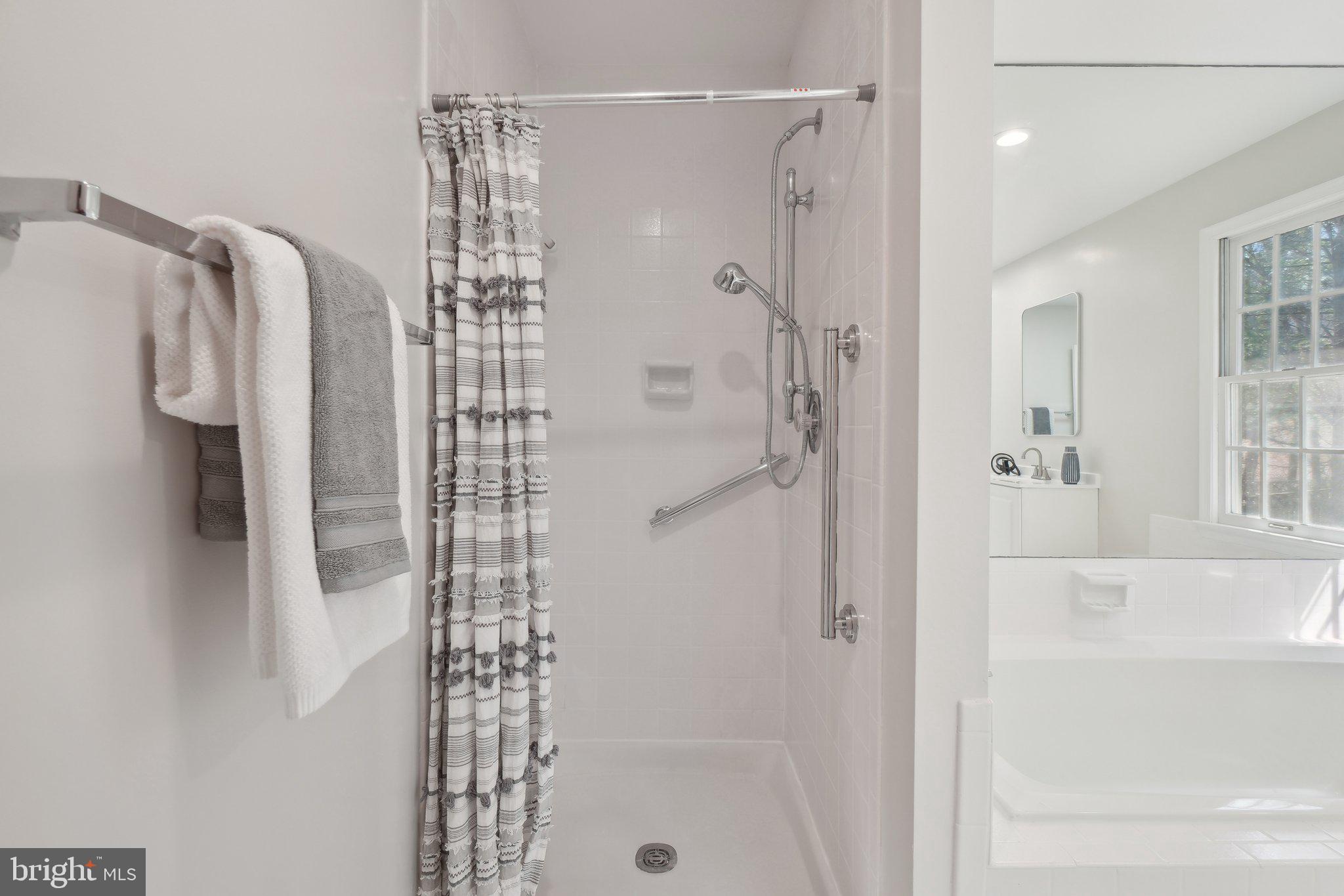 15301 Watergate Road Silver Spring, MD 20905 - Photo 20 of 51 a bathroom with a shower and a tub