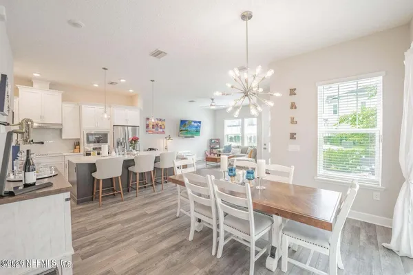 a kitchen with kitchen island a white counter top space and appliances