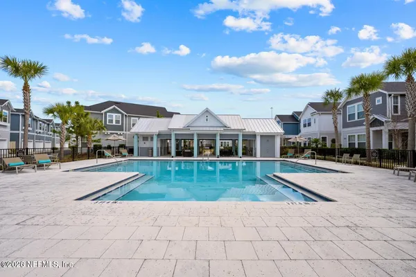 a view of a swimming pool with a patio