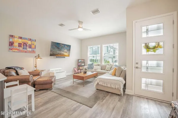 a living room with furniture and a large window