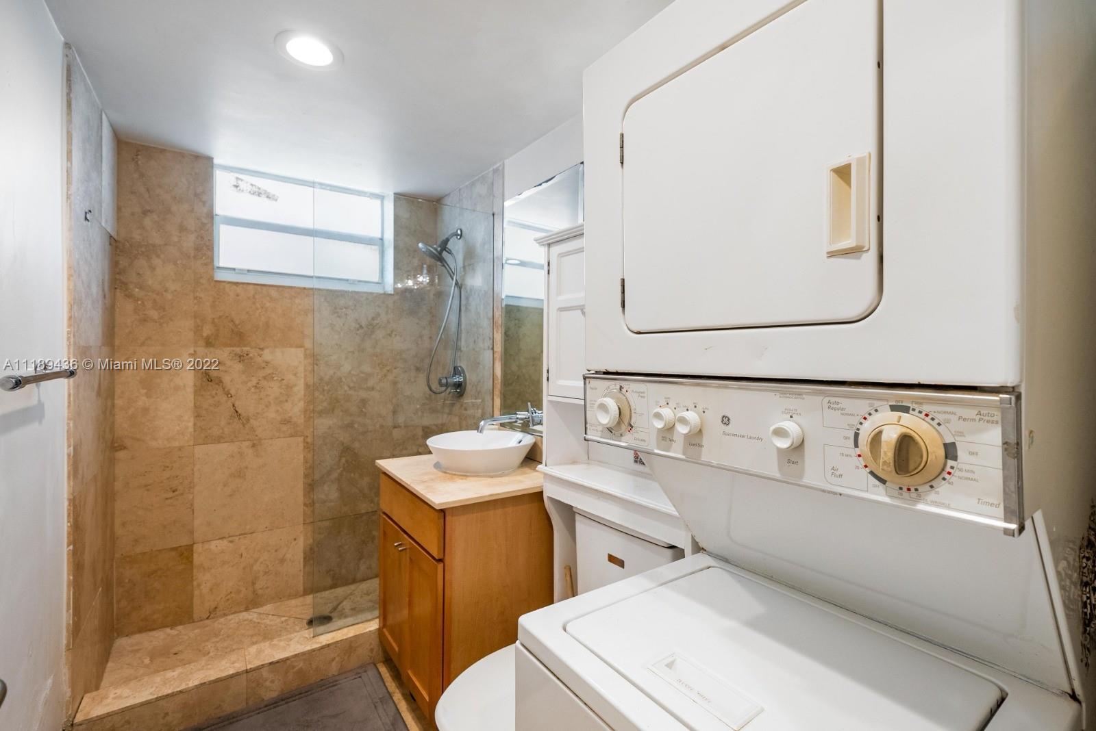 751 Collins Avenue, Unit 6 Miami Beach, FL 33139 - Photo 9 of 15 a bathroom with a sink toilet and shower