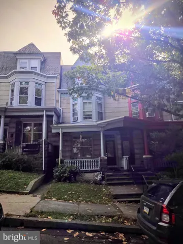 a view of a brick building with many windows