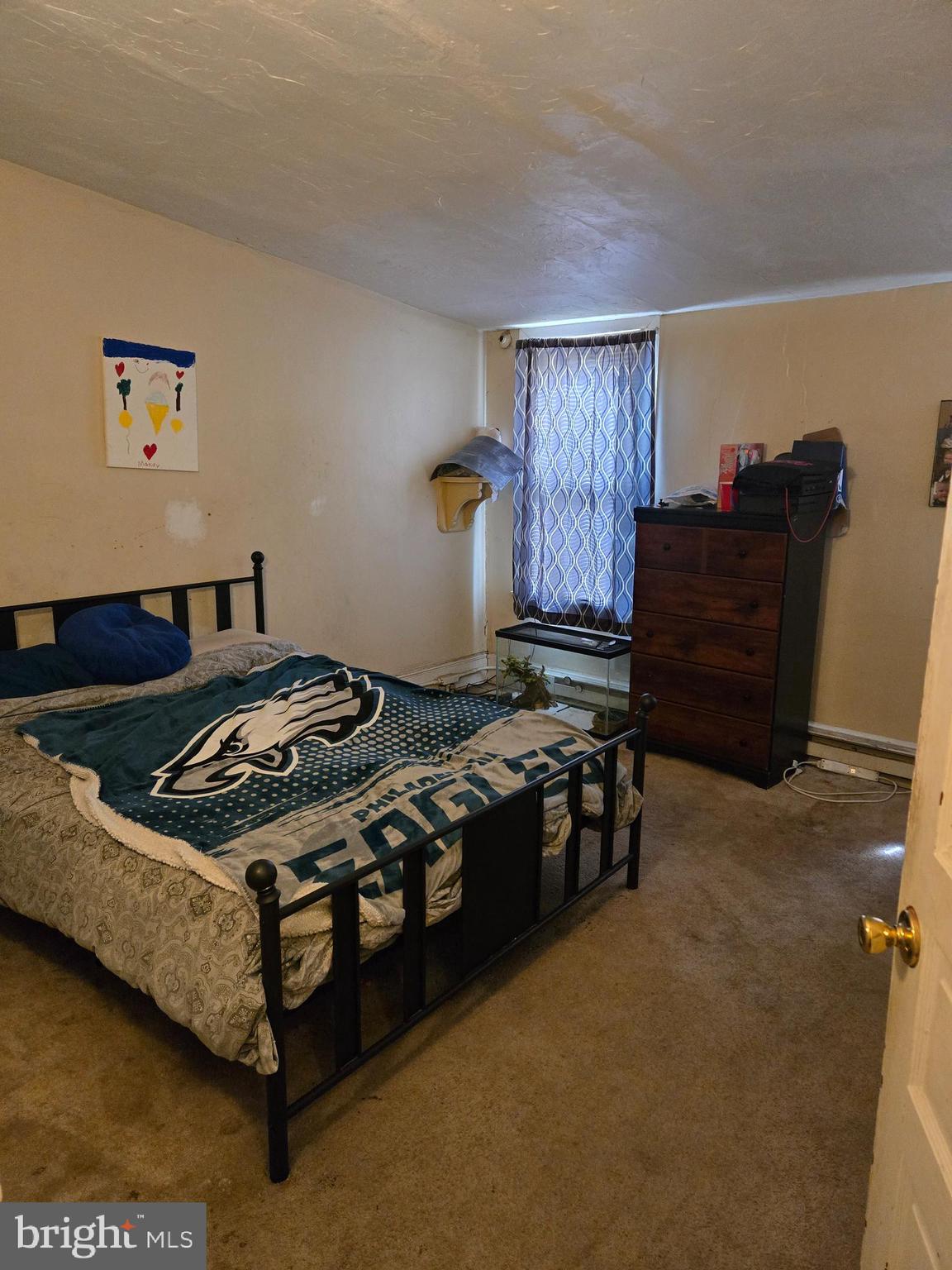 1238 Eckert Avenue Reading, PA 19602 - Photo 14 of 15 a bedroom with a bed and a dresser