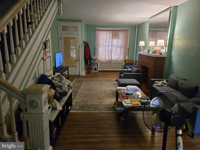 a room with furniture and wooden floor