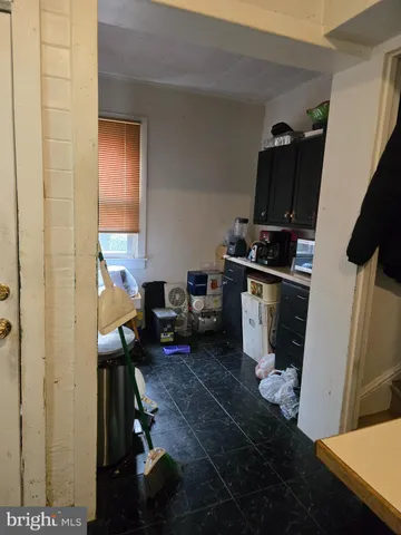 a kitchen with a sink appliances and cabinets