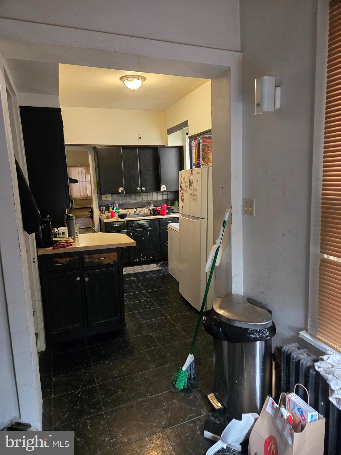 1238 Eckert Avenue Reading, PA 19602 - Photo 6 of 15 a room with furniture a flat screen tv and a window