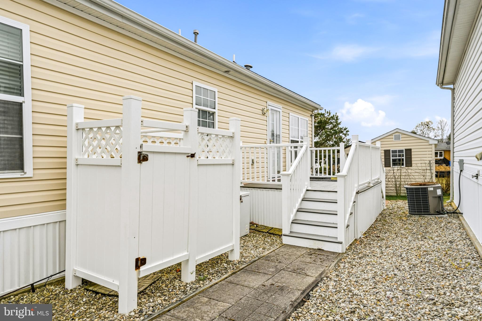 430 Rt Us 9 Street South, Unit 137 Marmora, NJ 08223 - Photo 21 of 24 a view of a house with stairs and a yard