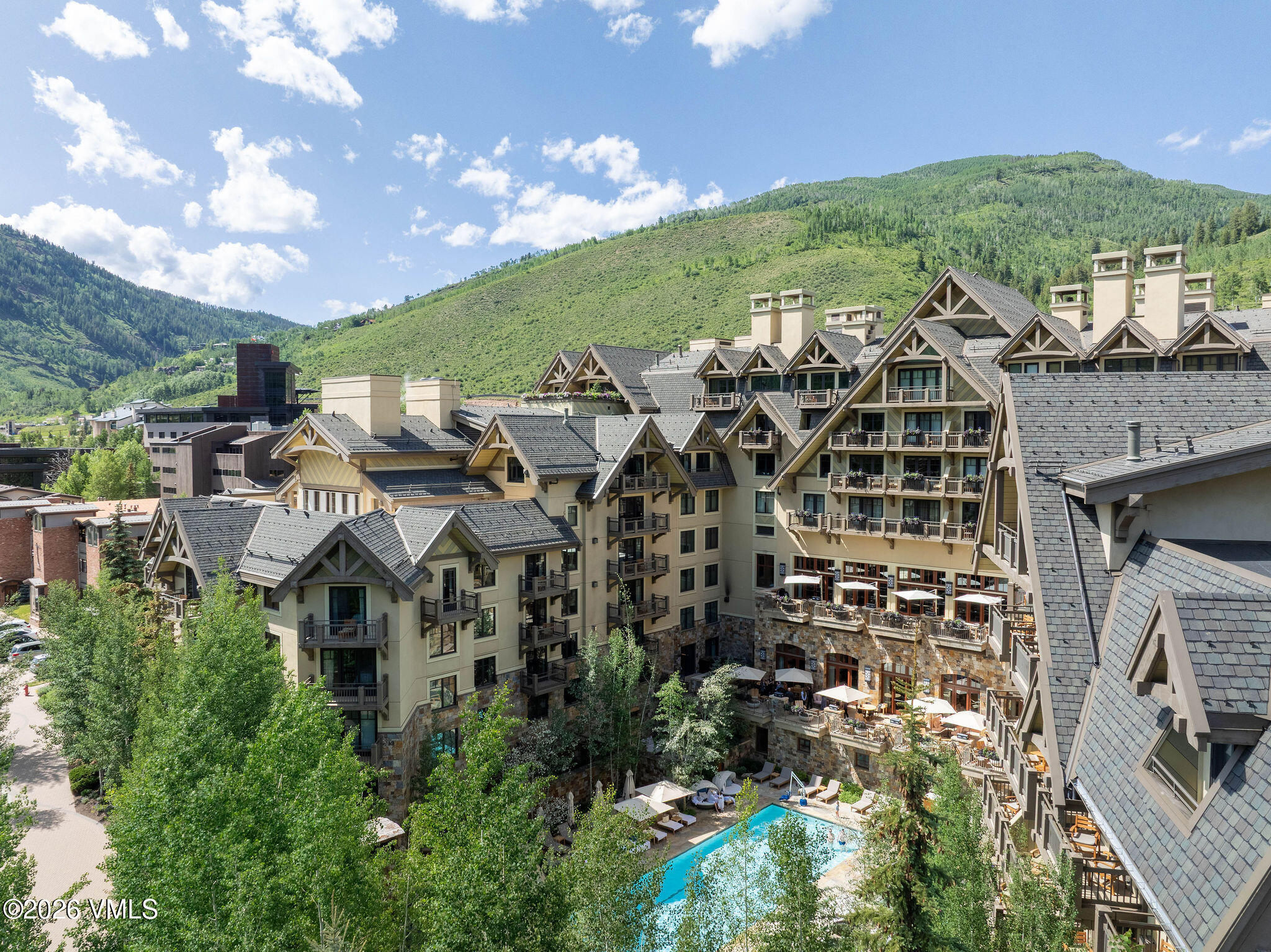 1 Vail Road, Unit 5102J Vail, CO 81657 - Photo 21 of 26 a picture of a building with a yard