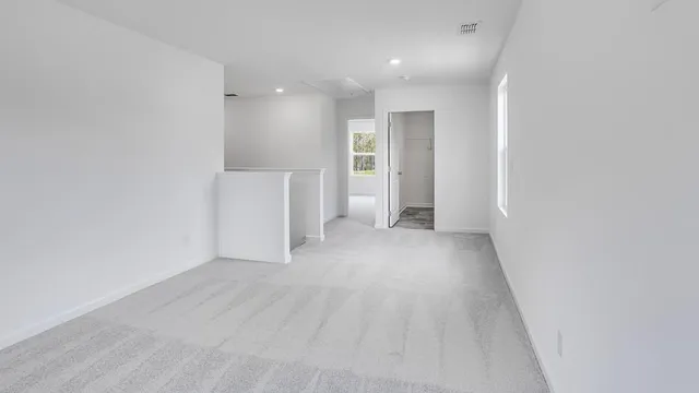 a view of a hallway with an empty room