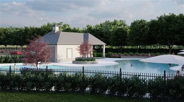 a view of a house with a yard and sitting area