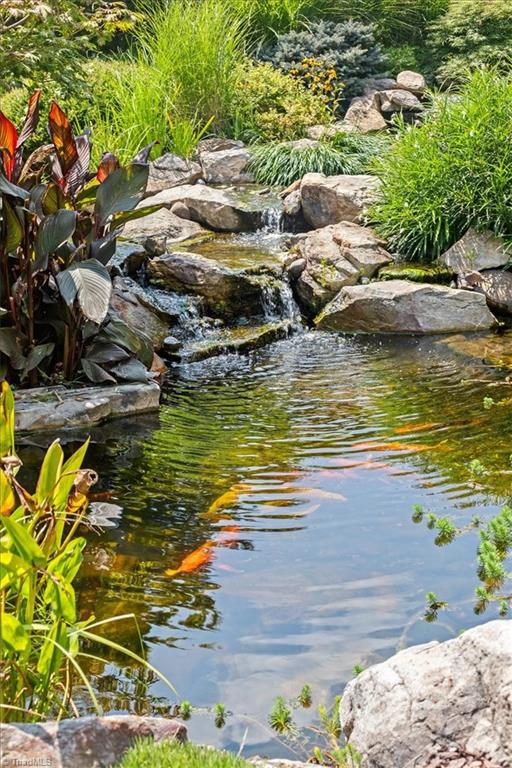 8400 Parkchester Place Oak Ridge, NC 27310 - Photo 31 of 49 one of several waterfall features