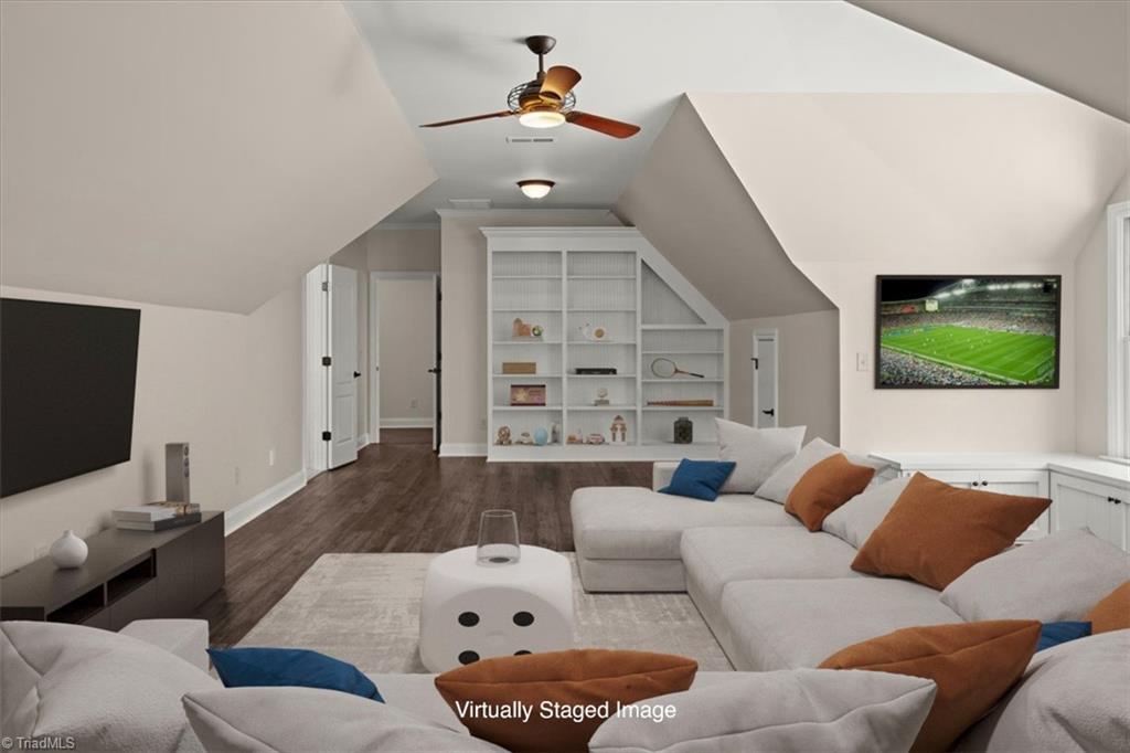 8400 Parkchester Place Oak Ridge, NC 27310 - Photo 34 of 49 another view of the bonus room on second floorfilled with built in shelves and storage areas