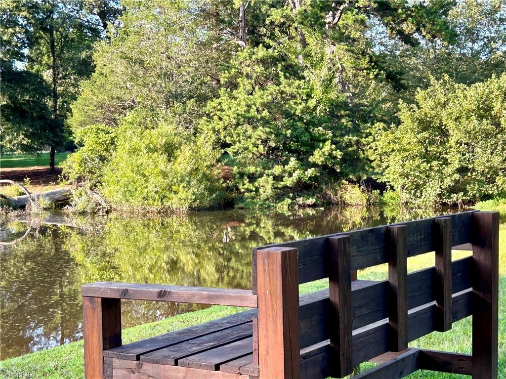 8400 Parkchester Place Oak Ridge, NC 27310 - Photo 45 of 49 large fenced in sideyard accessible by gate