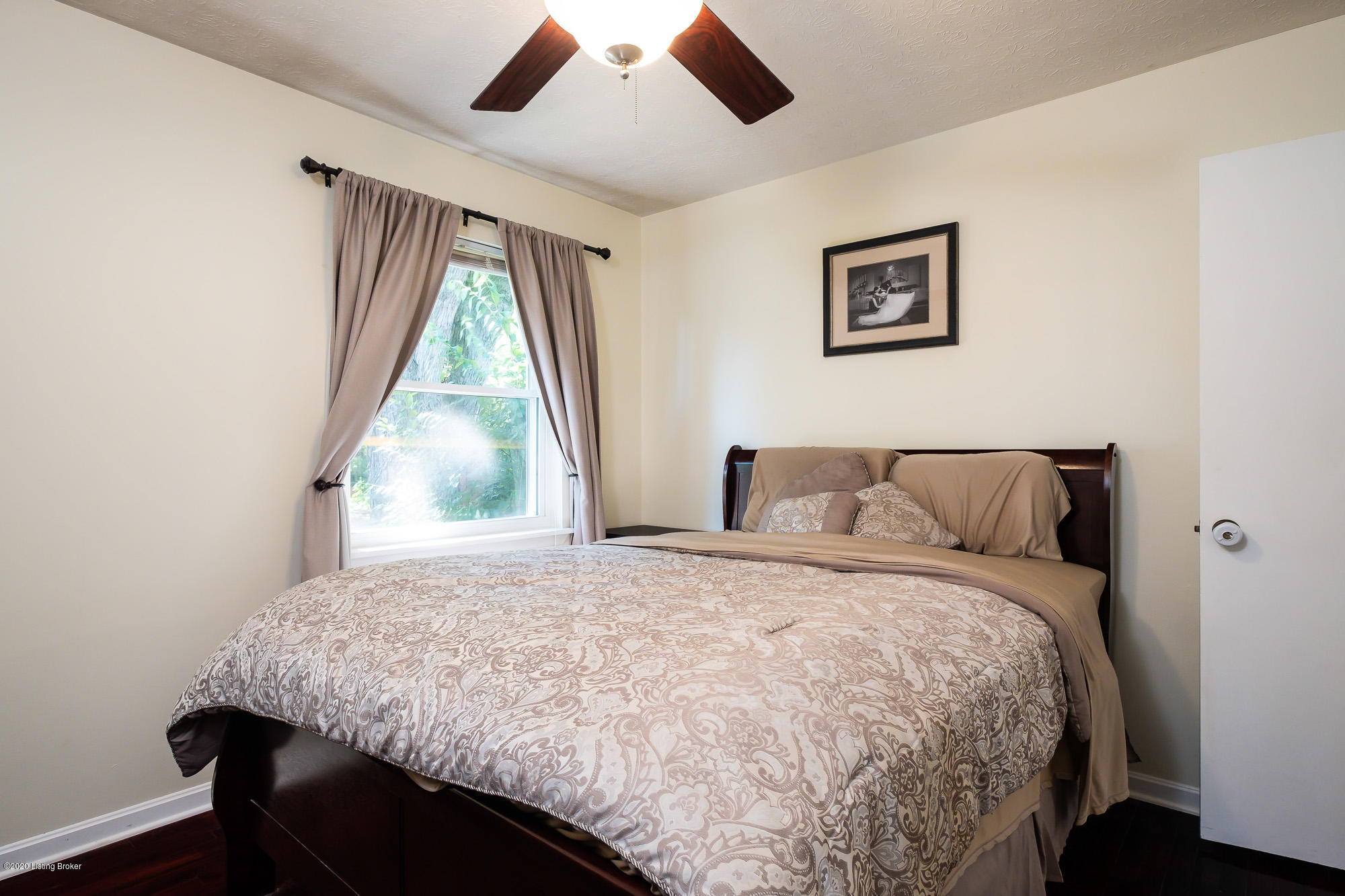 3705 Longview Road Louisville, KY 40299 - Photo 23 of 31 The master bedroom is the largest of the bedrooms and offers beautiful neutral colors and hardwood flooring.