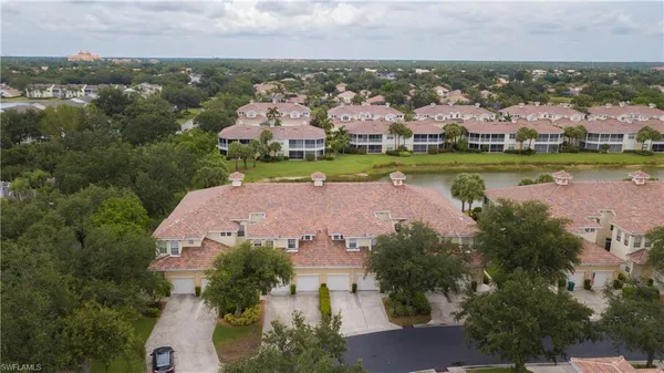 an aerial view of a house with a lake view