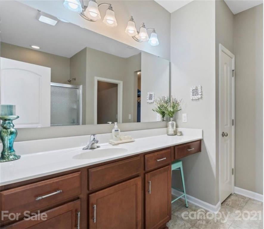 8098 Bryson Road Indian Land, SC 29707 - Photo 17 of 30 a bathroom with a sink double vanity and a mirror