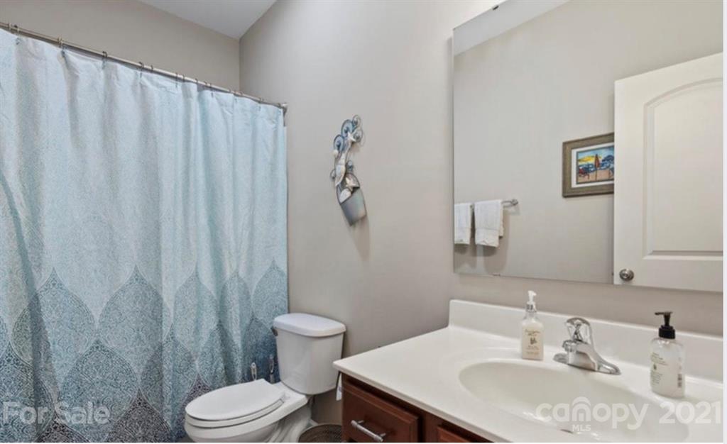 8098 Bryson Road Indian Land, SC 29707 - Photo 21 of 30 a bathroom with a sink toilet and shower