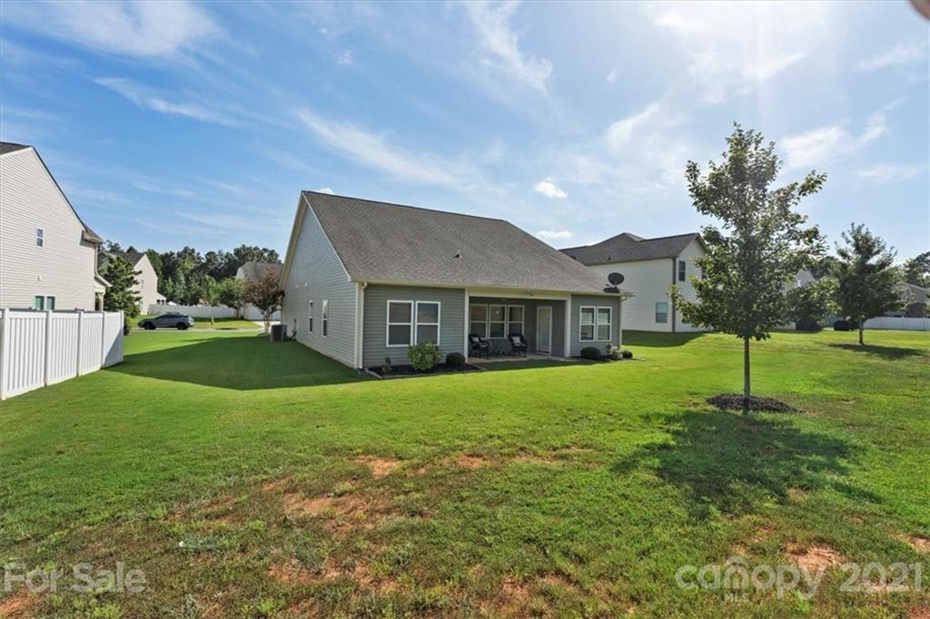 8098 Bryson Road Indian Land, SC 29707 - Photo 22 of 30 a aerial view of a house next to a big yard and large trees
