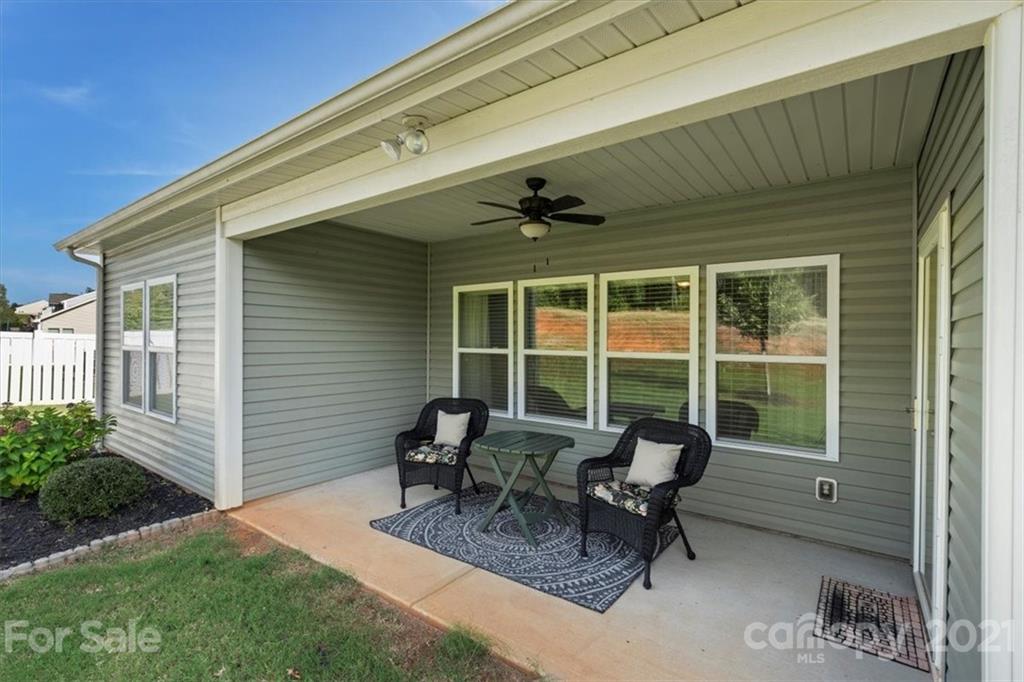 8098 Bryson Road Indian Land, SC 29707 - Photo 27 of 30 a view of a patio with table and chairs and potted plants