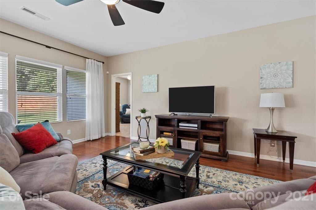 8098 Bryson Road Indian Land, SC 29707 - Photo 7 of 30 a living room with furniture and a flat screen tv