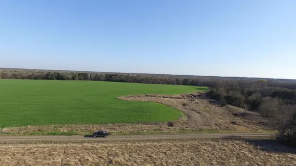 a view of a lake with houses in the back