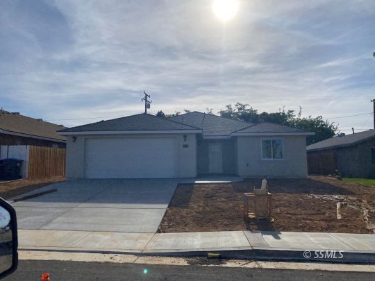 1213 Mayo Street Ridgecrest, CA 93555 - Photo 1 of 30 a front view of a house with yard