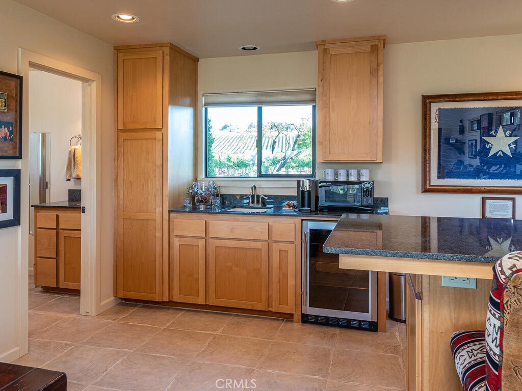 7790 Airport Road Paso Robles, CA 93446 - Photo 22 of 71 a kitchen with stainless steel appliances granite countertop a refrigerator and a stove top oven