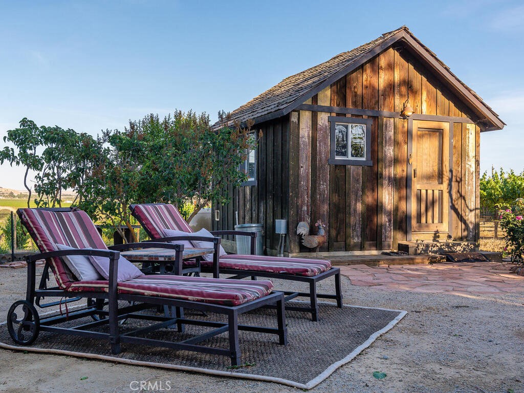7790 Airport Road Paso Robles, CA 93446 - Photo 35 of 71 a backyard of a house with outdoor seating