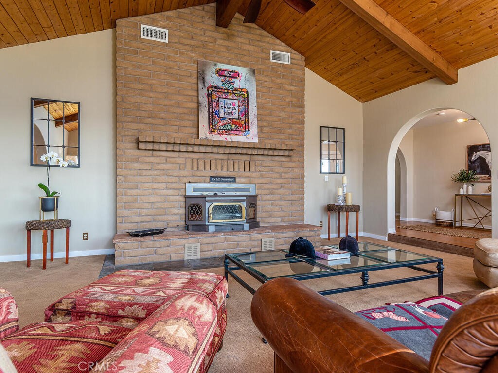 7790 Airport Road Paso Robles, CA 93446 - Photo 47 of 71 a bedroom with furniture and a fireplace