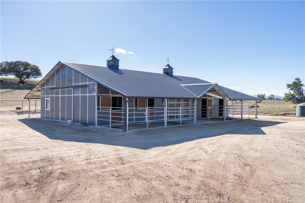 7790 Airport Road Paso Robles, CA 93446 - Photo 61 of 71 a front view of a house with a yard covered in snow