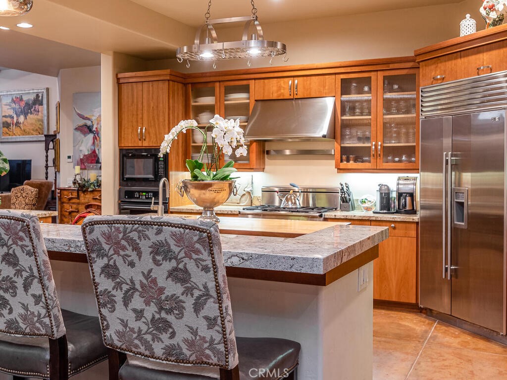 7790 Airport Road Paso Robles, CA 93446 - Photo 8 of 71 a kitchen with stainless steel appliances granite countertop a stove and more cabinets