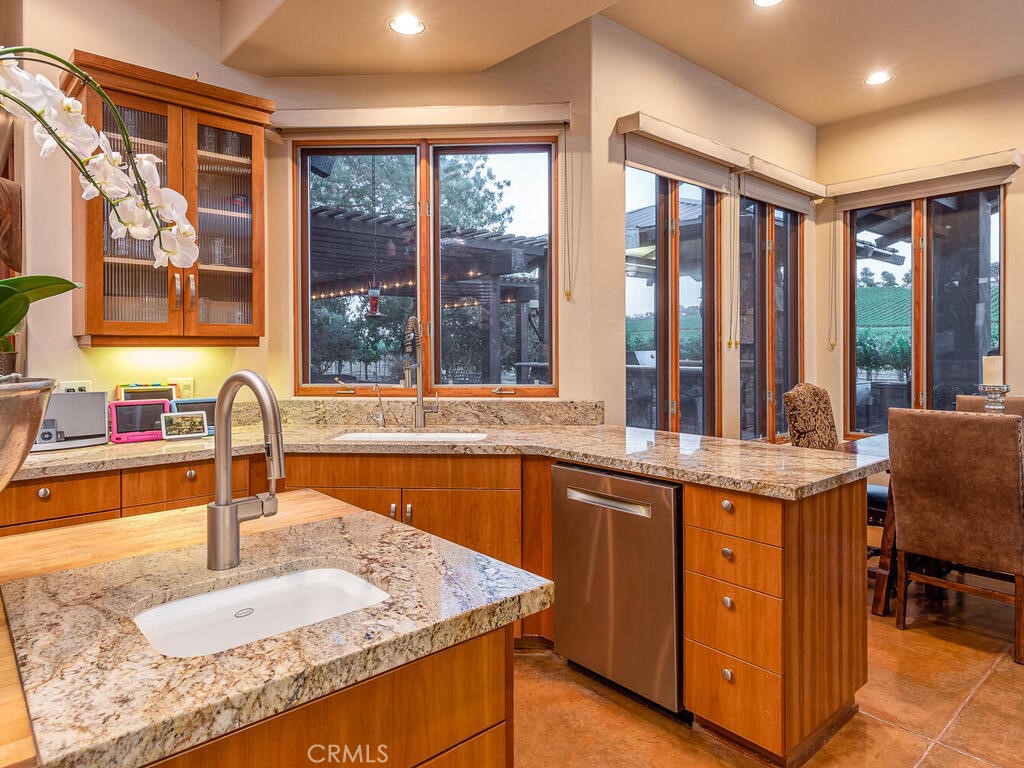 7790 Airport Road Paso Robles, CA 93446 - Photo 10 of 71 a kitchen with stainless steel appliances granite countertop a sink and a stove
