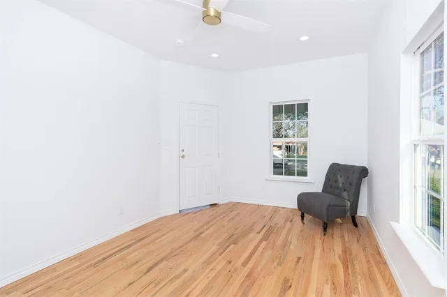 a bedroom with a bed and a chair