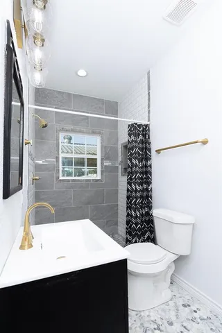 a bathroom with a bathtub a sink and a toilet