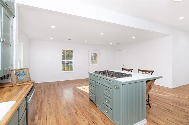 a kitchen with stainless steel appliances granite countertop a stove and a sink