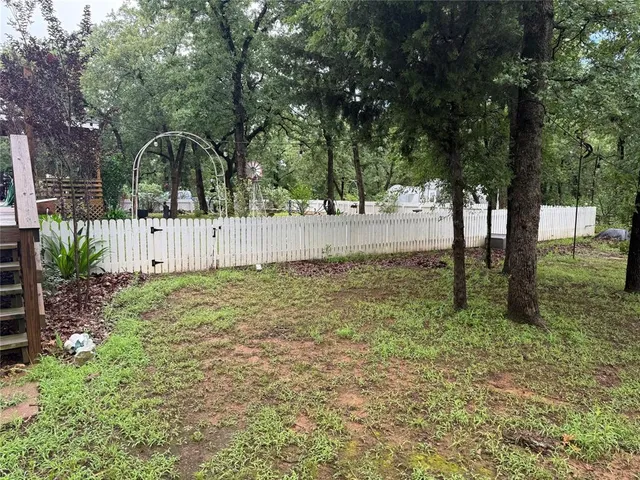 a view of backyard with tree