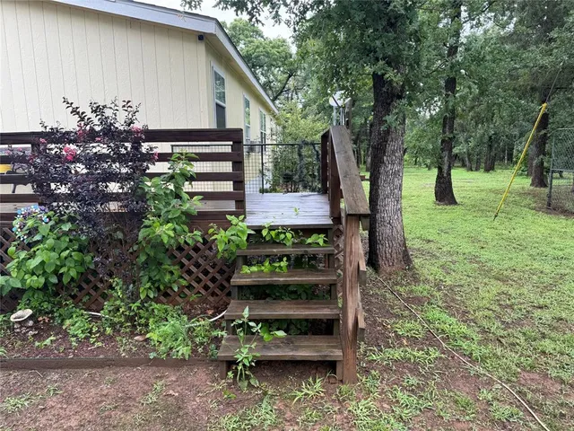 a backyard of a house with lots of green space