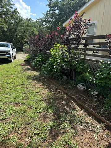 a large swimming pool with a yard in front of it