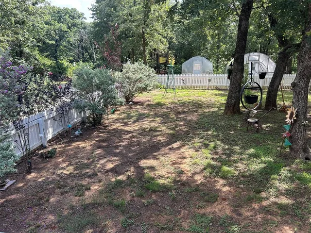 a backyard of a house with lots of green space
