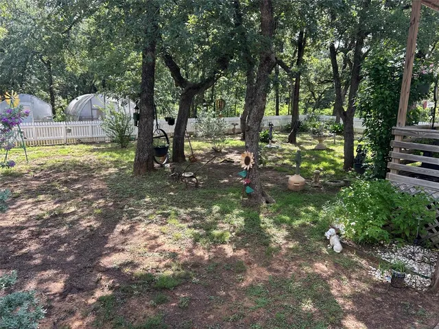 a backyard of a house with lots of green space
