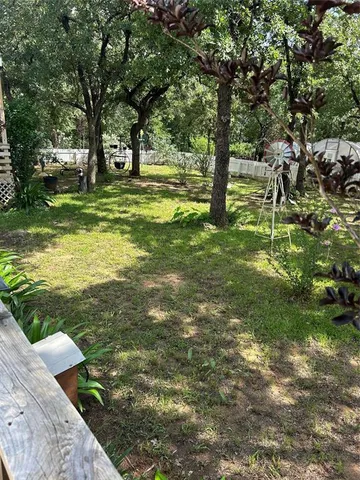 a view of a wooden deck with chairs