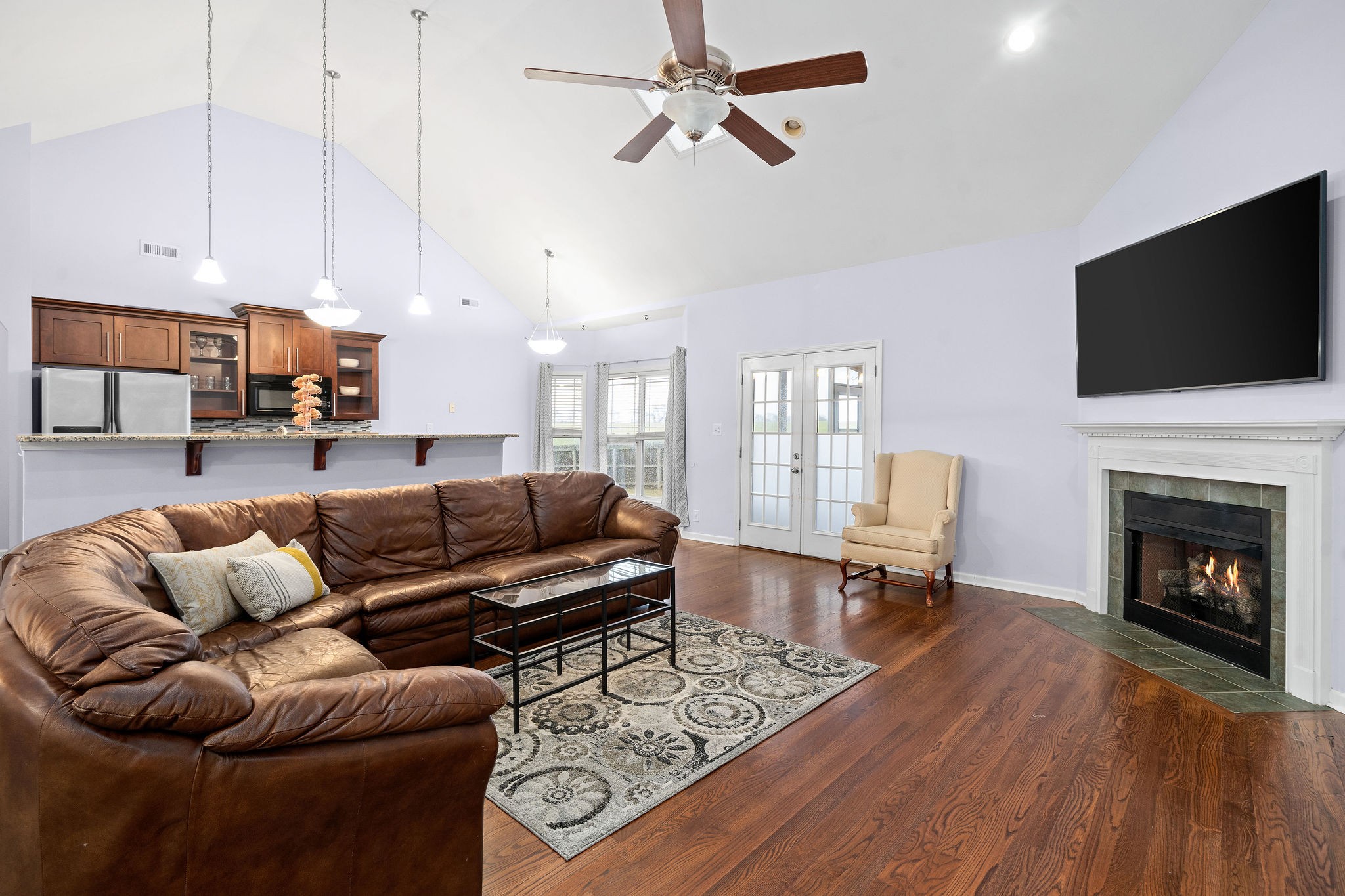 233 Barkers Mill Road Pembroke, KY 42266 - Photo 13 of 48 a living room with furniture a flat screen tv and a fireplace