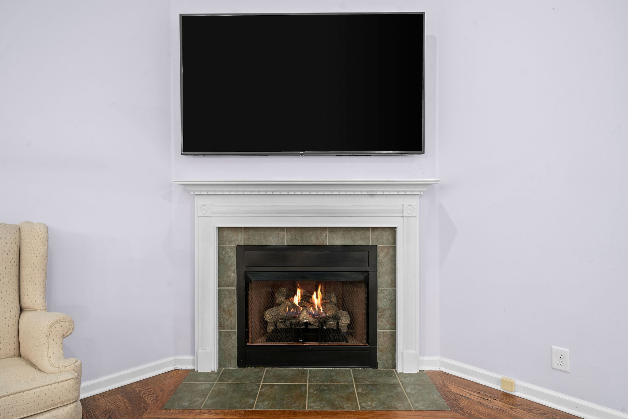 233 Barkers Mill Road Pembroke, KY 42266 - Photo 16 of 48 a living room with a fireplace and a flat screen tv