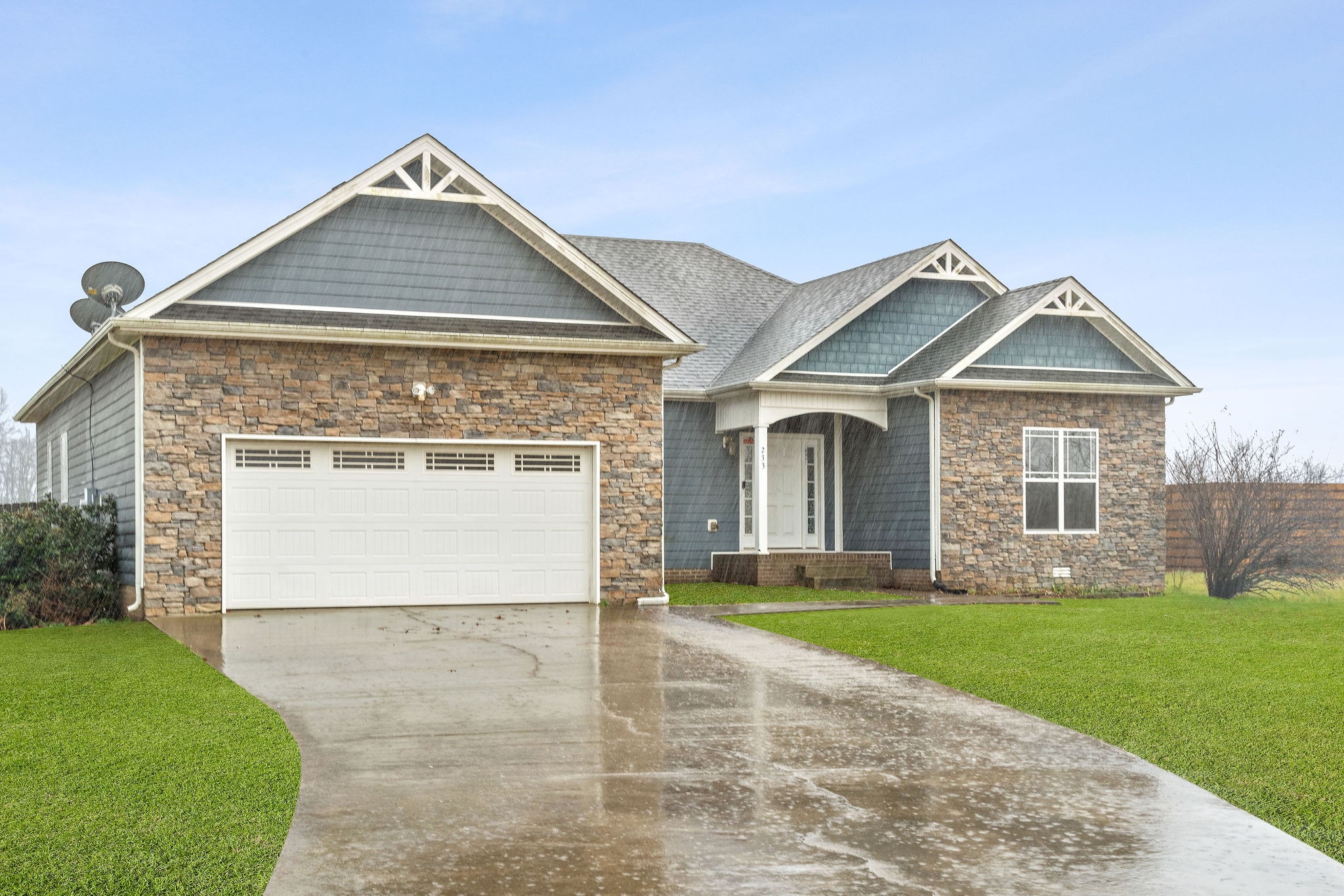 233 Barkers Mill Road Pembroke, KY 42266 - Photo 2 of 48 a front view of a house with a yard and garage