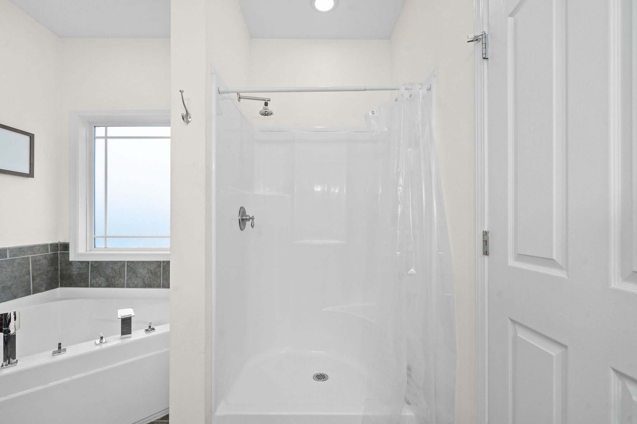 233 Barkers Mill Road Pembroke, KY 42266 - Photo 33 of 48 a bathroom with a bathtub and a shower