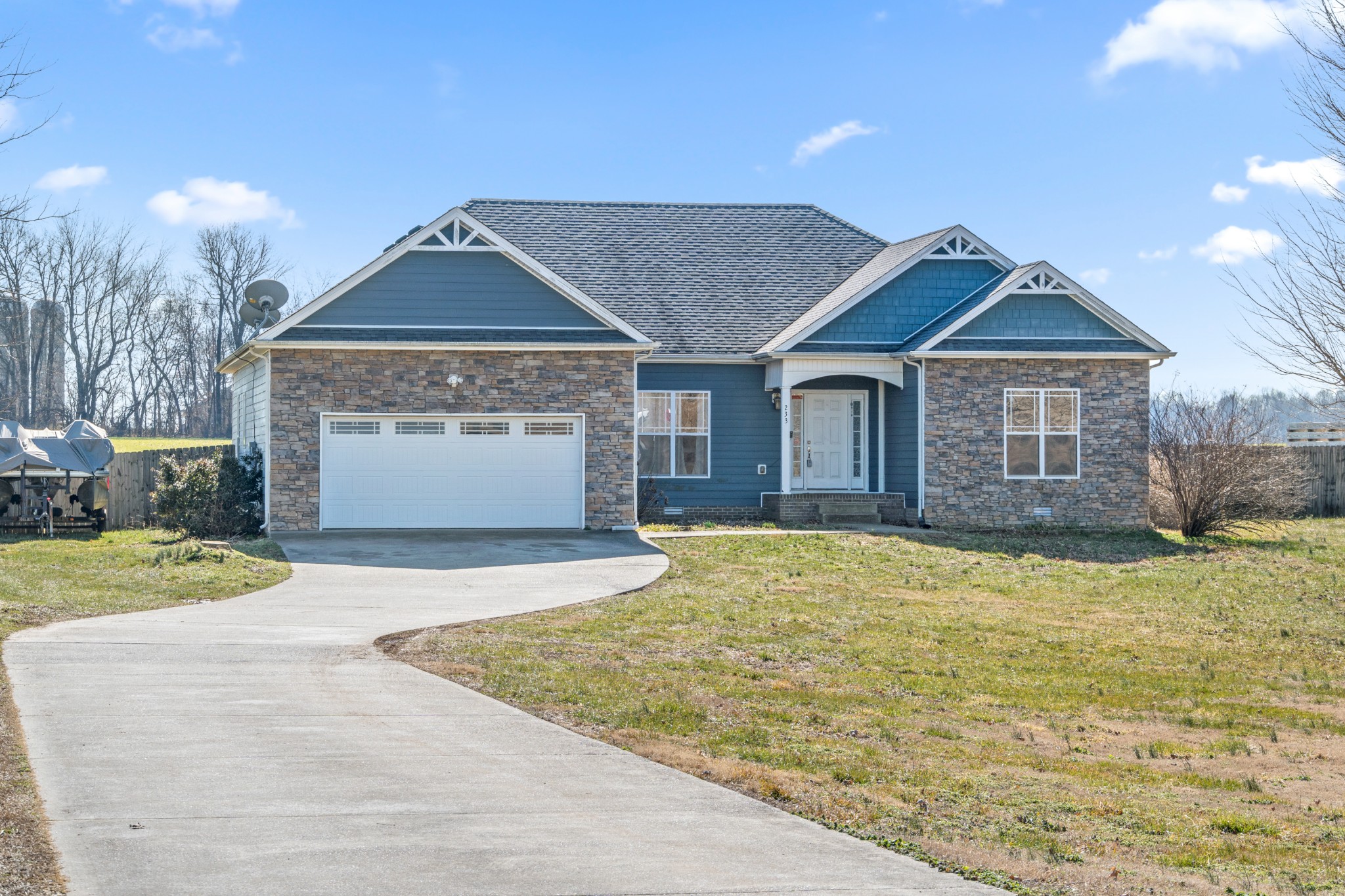 233 Barkers Mill Road Pembroke, KY 42266 - Photo 9 of 48 a front view of a house with a yard and garage