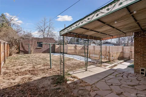 a view of a backyard with a patio